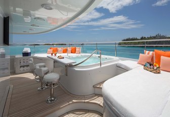 superyacht sundeck with jacuzzi and bar stools