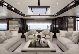 large white sofas and arm chairs in the main salon of luxury yacht Spectre