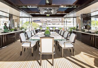 al fresco dining table under the radar arch aboard motor yacht Illusion V 