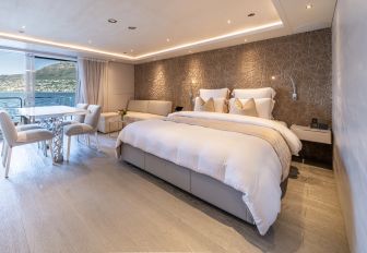 Charter yacht SALT guest cabin with central berth and seating