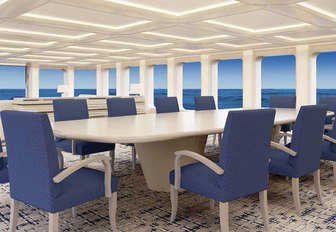 formal dining setup in the main salon on board luxury yacht AQUARIUS  