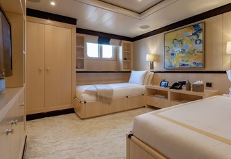 twin cabin with yellow colour scheme on board charter yacht La Mirage 