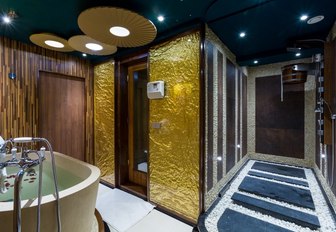 The Jacuzzi bath and gold deco of the spa on board superyacht LEGEND