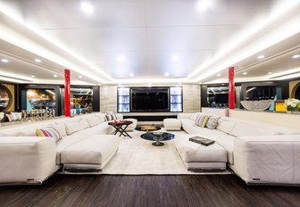 contemporary styled salon with huge sofas on board charter yacht SALUZI