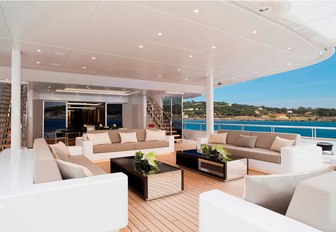 aft deck lounge and dining area on board motor yacht Mogambo