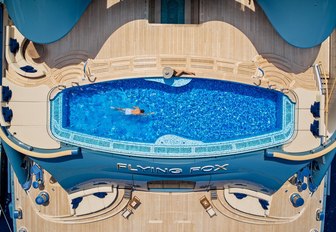 Aerial view looking directly on the swimming pool onboard superyacht charter FLYING FOX