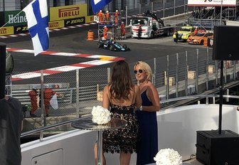 two women chatting onboard a yacht watching the Monaco Grand Prix