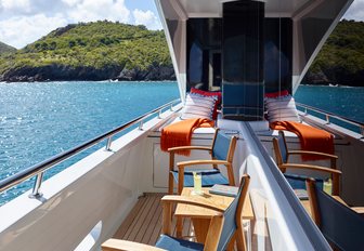 chairs in port-side balcony overlooking the water on board charter yacht ‘Victoria del Mar’ 