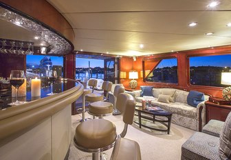 bar and seating in the skylounge of motor yacht Sweet Escape 