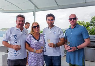 guests pose for a photo a the Kata Rocks Superyacht Rendezvous in Phuket, Thailand