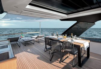 the alfresco ding area on the main deck aft deck of charter yacht lucky