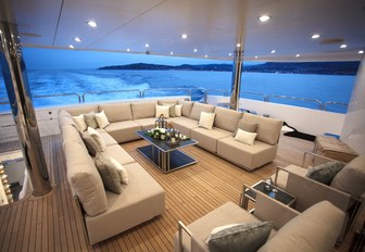 u-shaped seating area on the main deck aft of motor yacht ARADOS