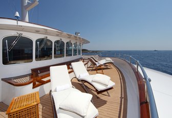 chaise loungers line the deck aboard superyacht SHERAKHAN 