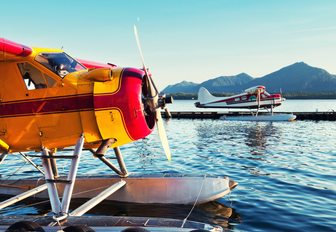 seaplanes line up in the docks ready for overhead glacier tours in Alaska