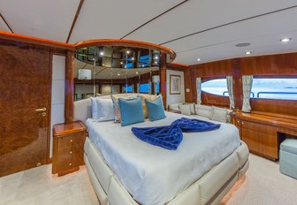  the luxurious master cabin inside charter yacht quintessa withking sized bed, private en suite facilities, and lounging area