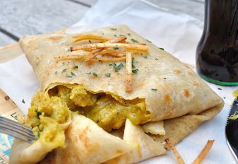 roti is enjoyed from street-side vendor in St James, Trinidad