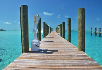 pier across the turquoise waters on Staniel Cay, Exumas, Bahamas