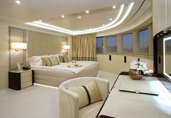 alluring master suite with bed, desk and 180-degree views aboard superyacht ROMA