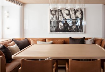 main salon with caramel coloured sofas on board charter yacht RH3 