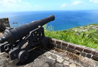 cannon looks out to see at the Brimstone Hill Fortress in St Kitts and Nevis 