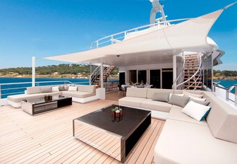 luxe deck area with seating and canopy on board luxury yacht Mogambo