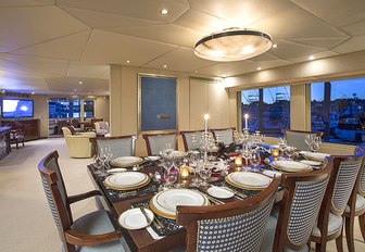 formal dining area in the main salon of motor yacht Sweet Escape 