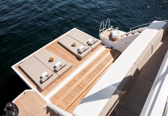 sunpads laid out on the fold-down swim platform of charter yacht Cheers 46 