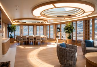 Interior seating areas with ample large windows onboard superyacht charter FLYING FOX