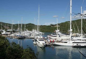 superyachts line up in an Antigua marina on a beautiful day