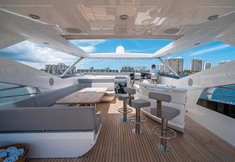Charter yacht QUANTUM flybridge and wet bar with stools