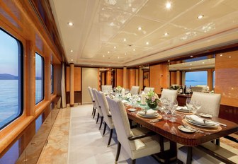 large, oblong dining table in the dining salon aboard luxury yacht Lucky Lady 