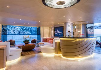 beach club with and seating and balconies on board superyacht Here Comes The Sun 