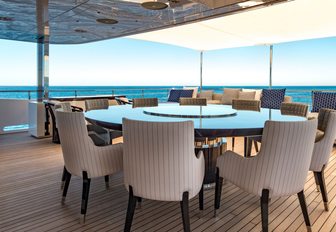 Chairs around dining table on superyacht RARITY