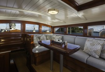 mahogany-clad salon on board charter yacht RAINBOW 