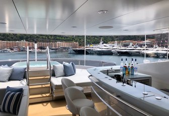 A bar and Jacuzzi on board a superyacht berthed in Port Hercules