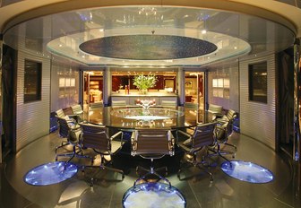 The lit up dining formal dining space on board superyacht 'Double Down'