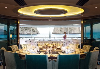 semi-alfresco dining setup on board charter yacht QUITE ESSENTIAL