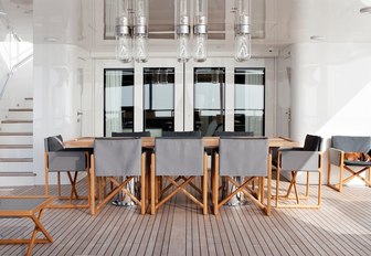 lanterns overlook an alfresco dining area on the upper deck aft of superyacht RH3 