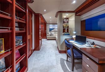 Super yacht charter PISCES private study with desk and bookshelves