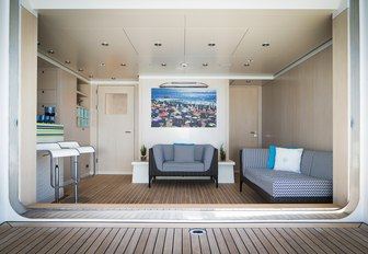 luxe teak-clad beach club on board charter yacht TITANIA 