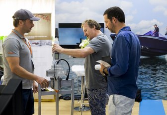 visitors at the Thailand Yacht Show & Rendezvous talk to an exhibitor