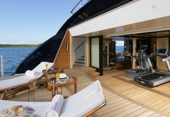 Beach club onboard yacht charter AMARYLLIS, sun loungers on swim platform with direct access to gym aft.