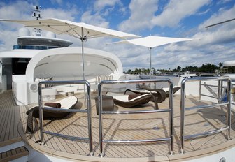 clam-shell seating area and sun pads on the foredeck of charter yacht Inception