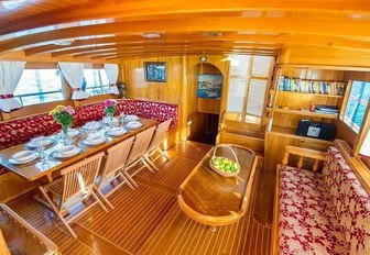 dining table and sofa in the main salon of luxury gulet ‘Kaya Guneri II’ 