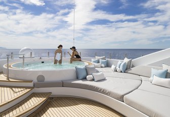 charter guests relax in the Jacuzzi on the sundeck of motor yacht TURQUOISE 