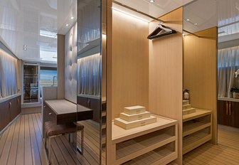 the spacious walk in wardrobe inside charter yacht freddy