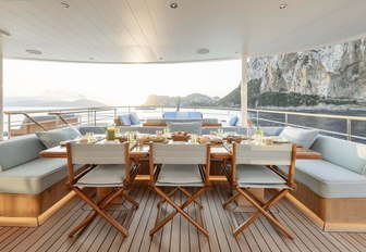 Covered outdoor dining area on explorer yacht 'Blue II'