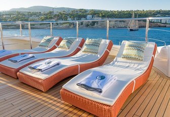 sun pads lined up on the sundeck of charter yacht Africa I