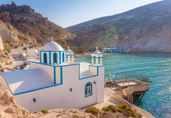 A church in Milos overlooking a bay