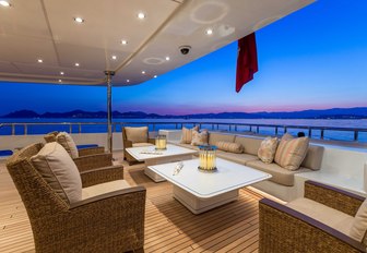 sumptuous seating area on the main deck aft of motor yacht Lucky Lady 